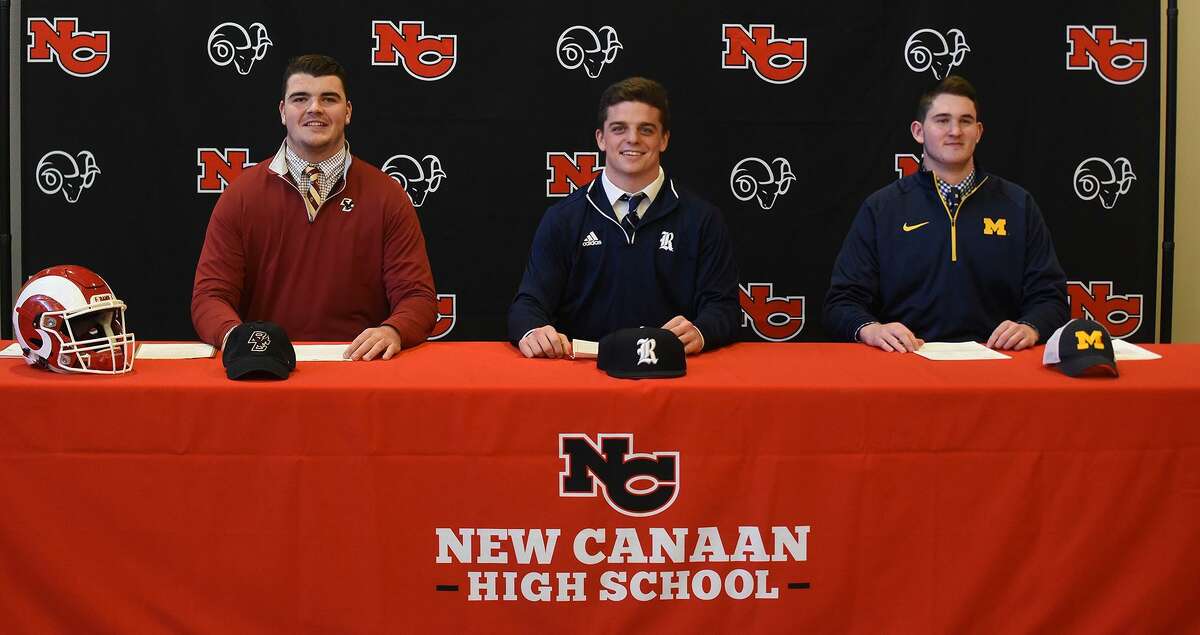 The New Canaan football program has three players sign their National Letters of Intent on Wednesday, Dec. 19, 2018. From left are Jack Conley (Boston College), Garrett Braden (Rice), and Jack Stewart (Michigan).