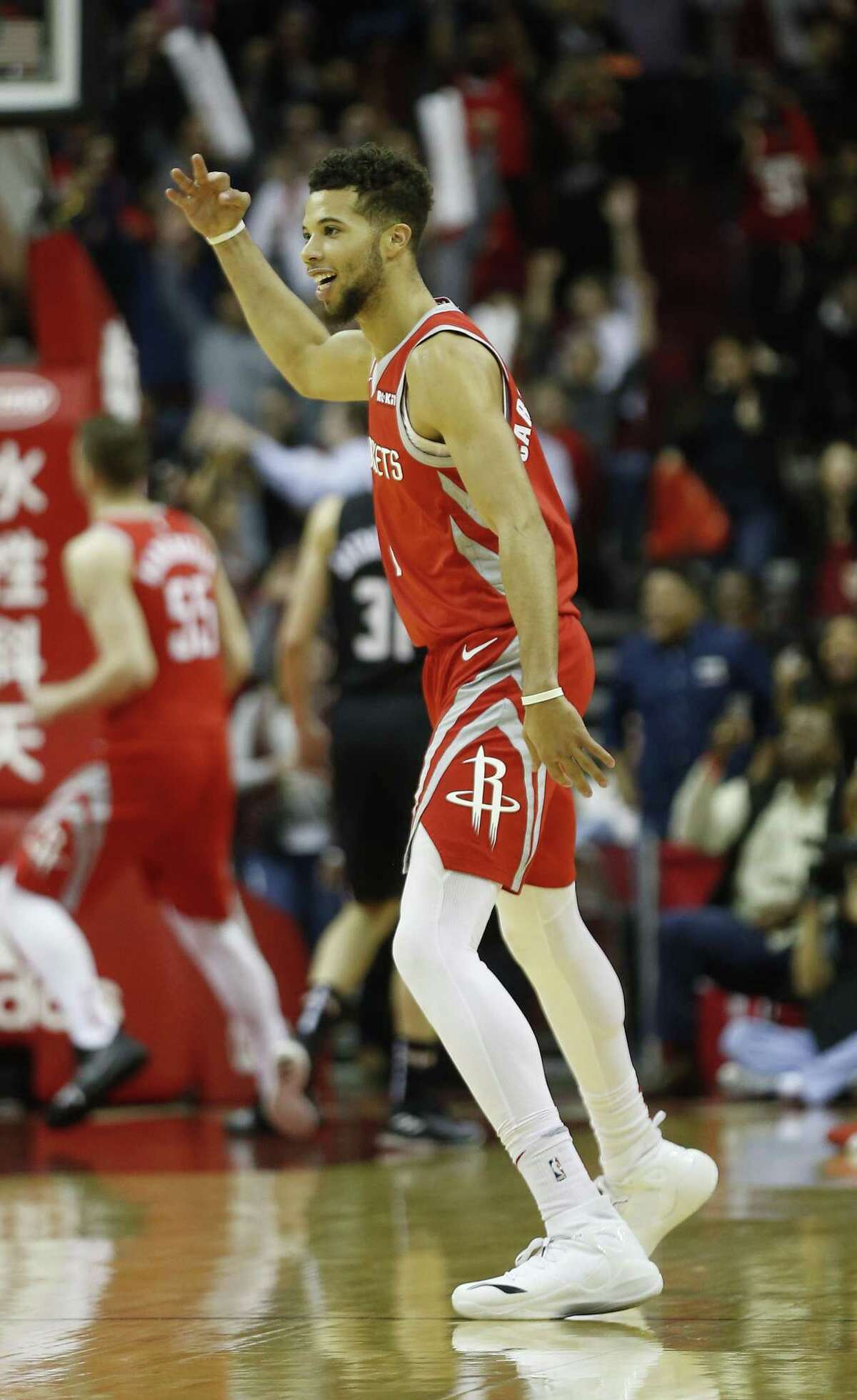 Rockets backup guard Michael Carter-Williams celebrates after his 3-pointer in the final seconds set the NBA record.