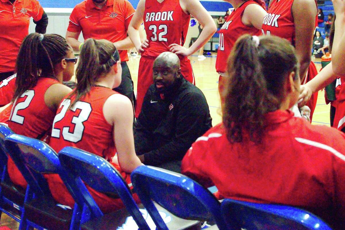 Clear Brook girls’ basketball coach Brandon Hudson speaks to his team during a break against Clear Springs Tuesday at Clear Springs High School.
