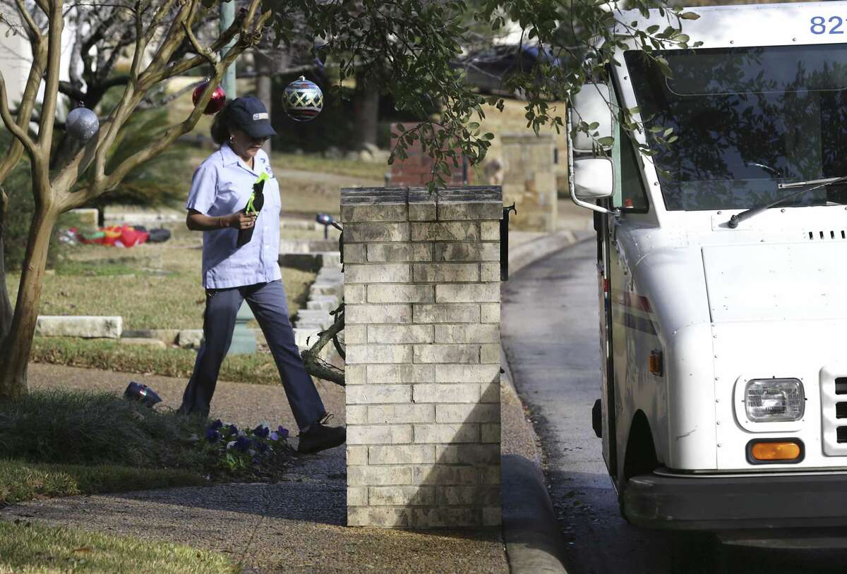 Dodging dogs, San Antonio mail carriers deliver the