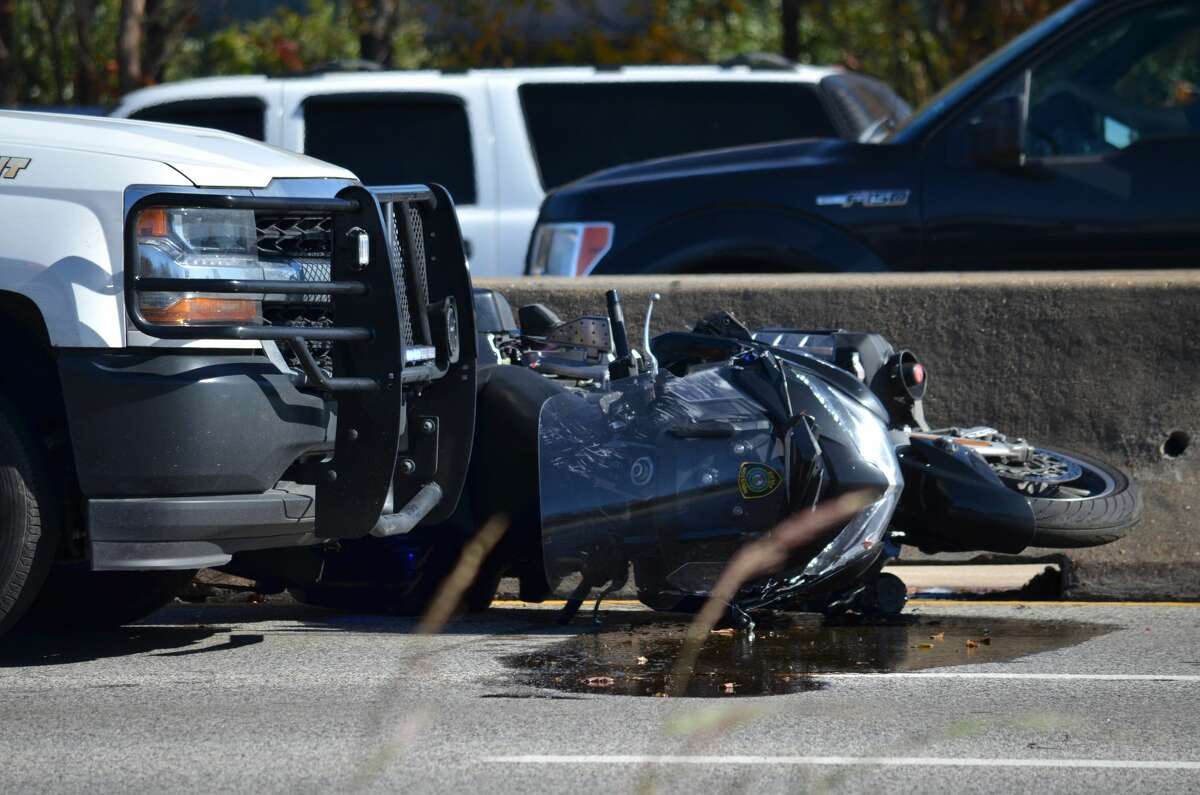 Houston PD says officer struck on motorcycle, collides with Harris Co