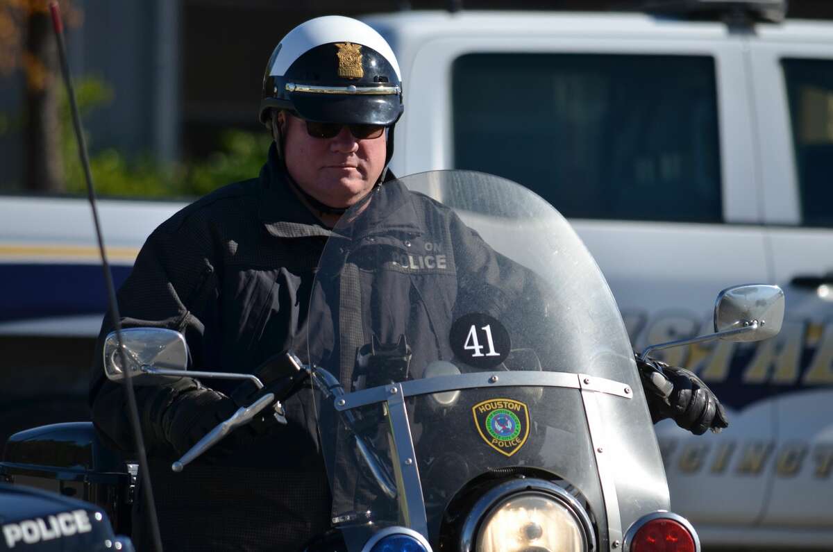 Houston PD says officer struck on motorcycle, collides with Harris Co