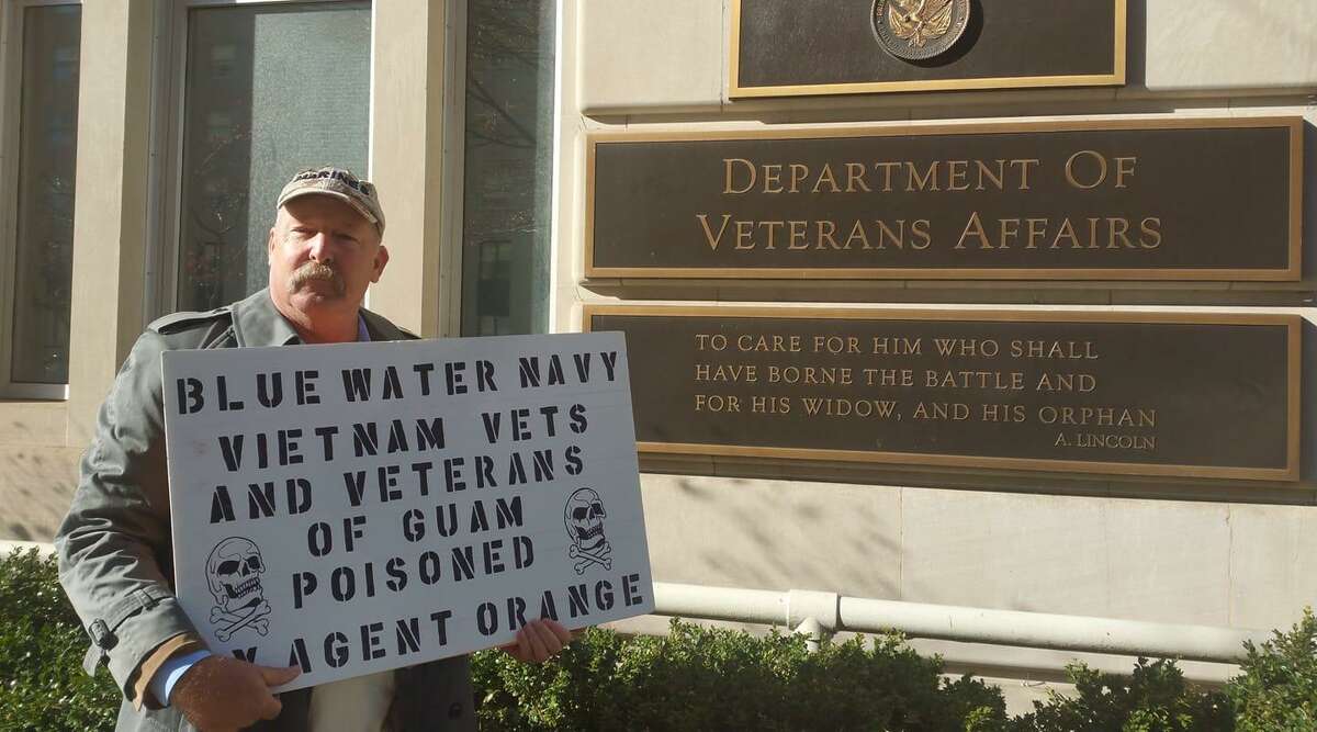 Brian Moyer a former marine who served on the island of Guam, joined Navy veterans in a protest march to the Department of Veterans Affairs on Dec. 7. Moyer, 63, who founded the website Agent Orange Survivors of Guam, believes exposure to herbicides caused his heart ailment, neuropathy and other ailments but the VA rejected his claim for disability benefits. ?“The VA needs to man up,?” he said. (Courtesy photo).