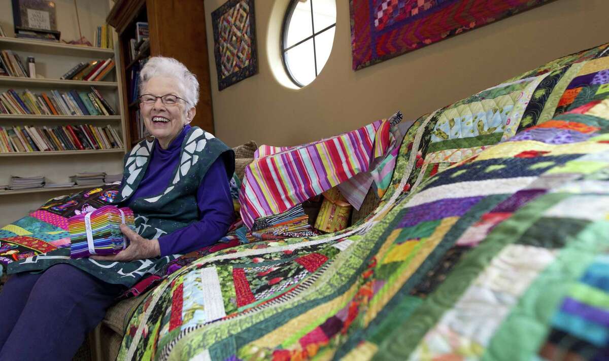 Quilter Ivy Jensen is seen among several of her pieces at her home, Tuesday, Dec. 18, 2018, in The Woodlands. Jensen has a piece in the Texas Quilt Museum show opening in January and also showing in France.