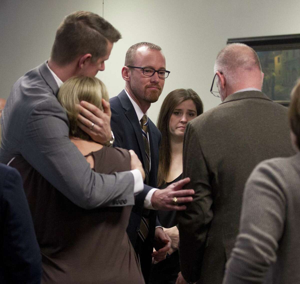 Marjorie Hantz, mother of Melinda Sedlmeier, is comforted by Chief Vehicular Crimes Prosecutor Andrew James as Tyler Dunman, chief prosecutor with the Montgomery County District Attorney's Office, comforts Charlie Lumpkin, brother-in-law of Roland Sedlmeier, following a sentencing hearing for Ronald Cooper in the 359th state District Court at the Montgomery County Courthouse, Friday, May 5, 2017, in Conroe. Cooper was handed an 80-year prison sentence for causing the 2015 crash that killed Roland Sedlmeier, 49, Melinda Sedlmeier, 42, Harley Sedlmeier, 6, and Sofie Sedlmeier, 4, all of whom were on their way home from church on Texas 105 at the time of the crash. Two teenagers were also injured in the wreck.