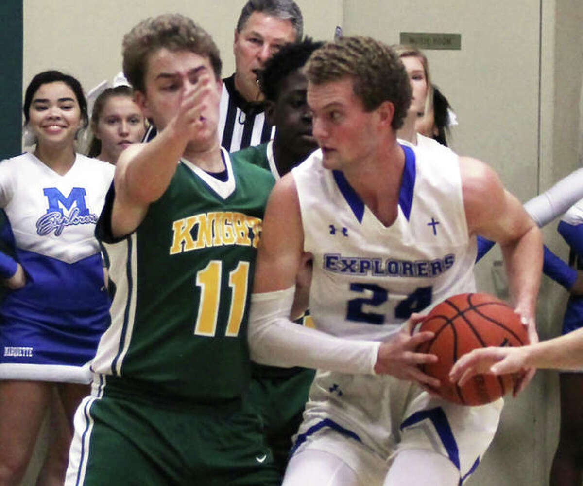 Marquette’s Nick Hemann (right), shown in a game earlier this season at Metro-East Lutheran, scored a game-high 17 points on Thursday night to lead the Explorers past Belleville Althoff in Belleville.
