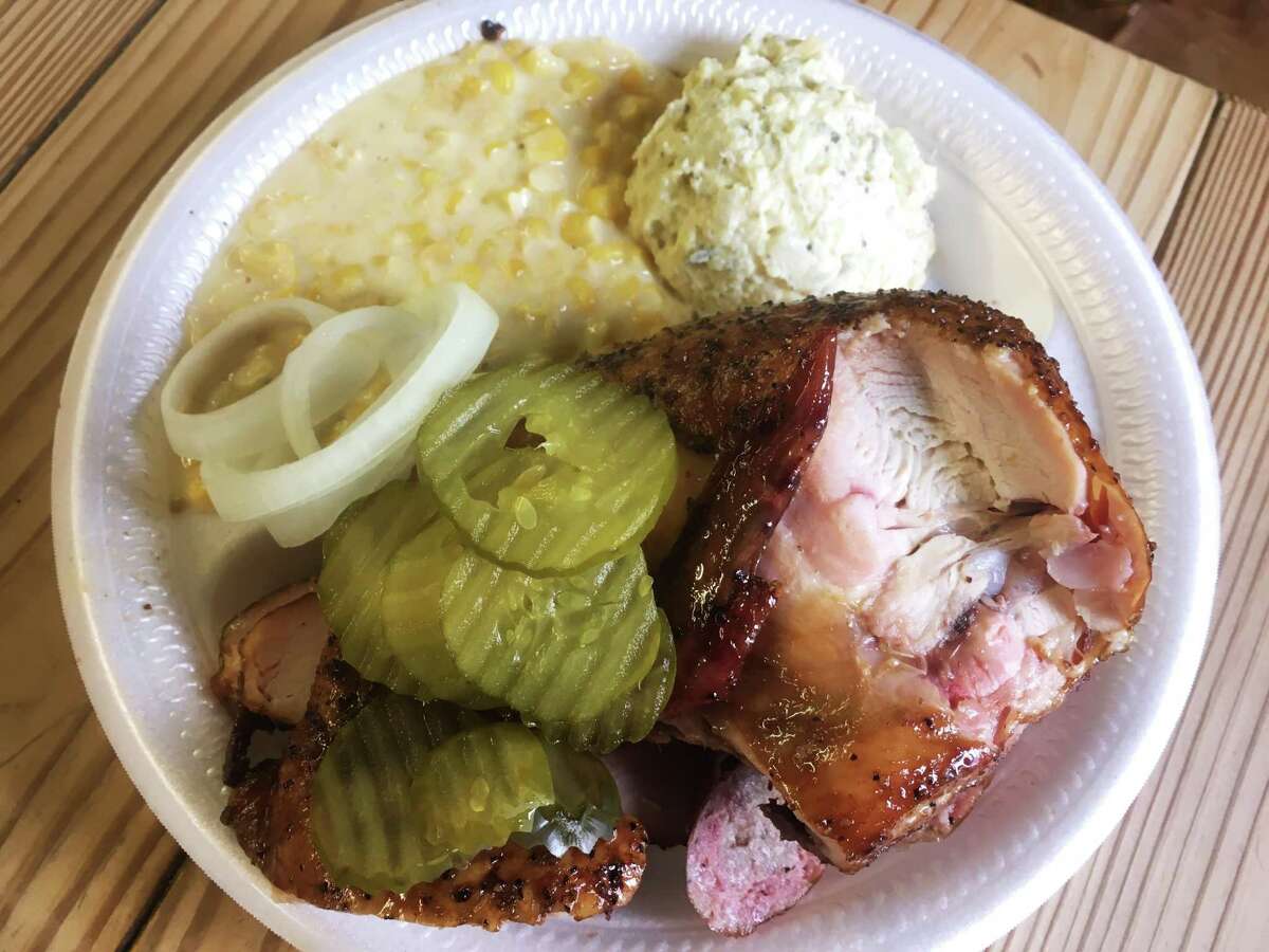 The three-meat plate ($12.50) at Heavy's Bar-B-Que with chicken, sausage and turkey and sides of creamed corn and potato salad.