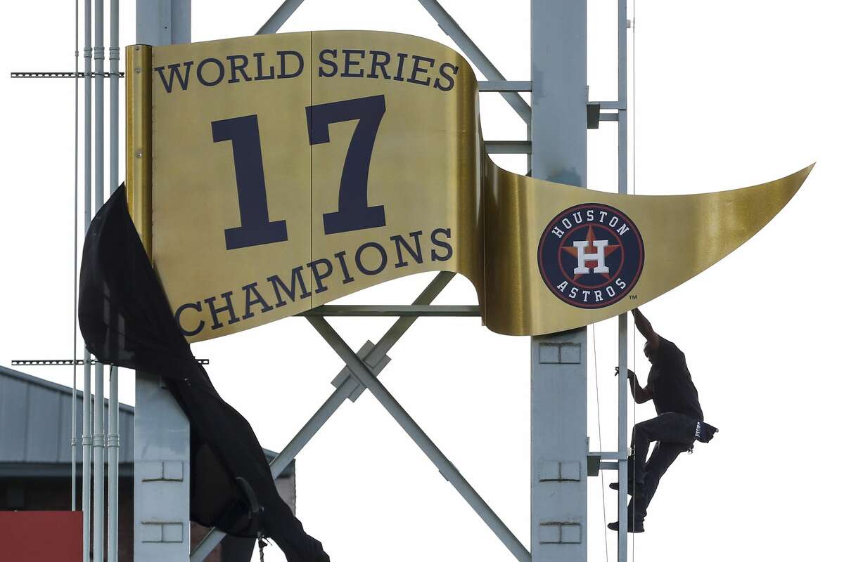 Astros 2022 World Series Champions pennant hung outside Minute Maid Park