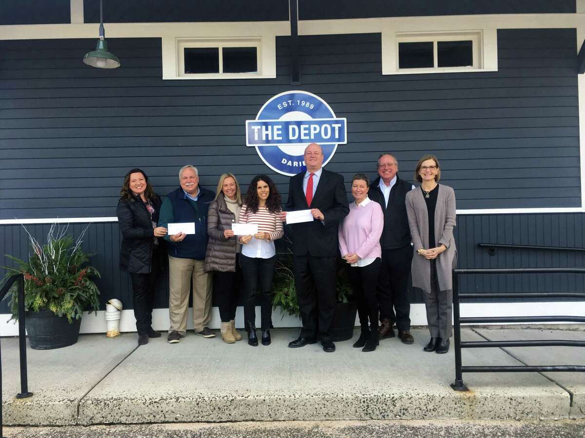 The Darien Chamber of Commerce recently awarded The Depot, Star Inc., and the Darien Chamber Charitable Foundation donations from the annual Wine and Food Tasting. From left, Teresa Jandziol, business manager, Darien Chamber of Commerce; Peter Saverine, director of Philanthropy, Star Inc.; Melissa Cutler, Fundraising co-chairwoman, The Depot; Gina Vivenzio, Fundraising co-chair, The Depot; Mark Rosenbloom, chairman, Darien Chamber Charitable Foundation; Cheryl Williams, event co-chair, Darien Chamber of Commerce; Al Tibbetts, event co-chair, Darien Chamber of Commerce; and Susan Cator, president, executive director, Darien Chamber of Commerce.