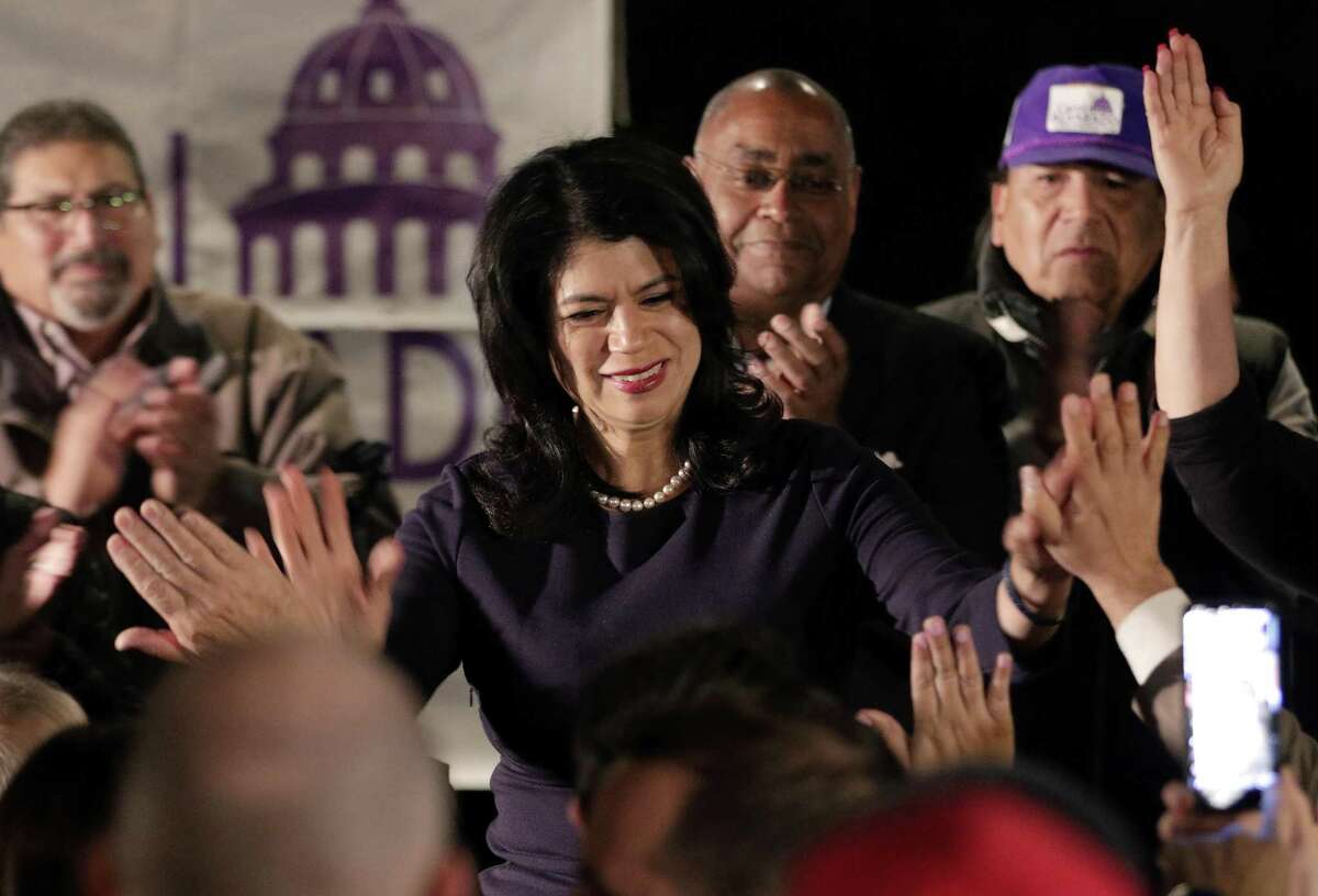 Carol Alvarado high fives attendants from the stage as she gives remarks at her watch party held at Raven Tower Tuesday, Dec. 11, 2018 in Houston, TX. >>See the firsts from this year's midterm elections in the photos that follow...
