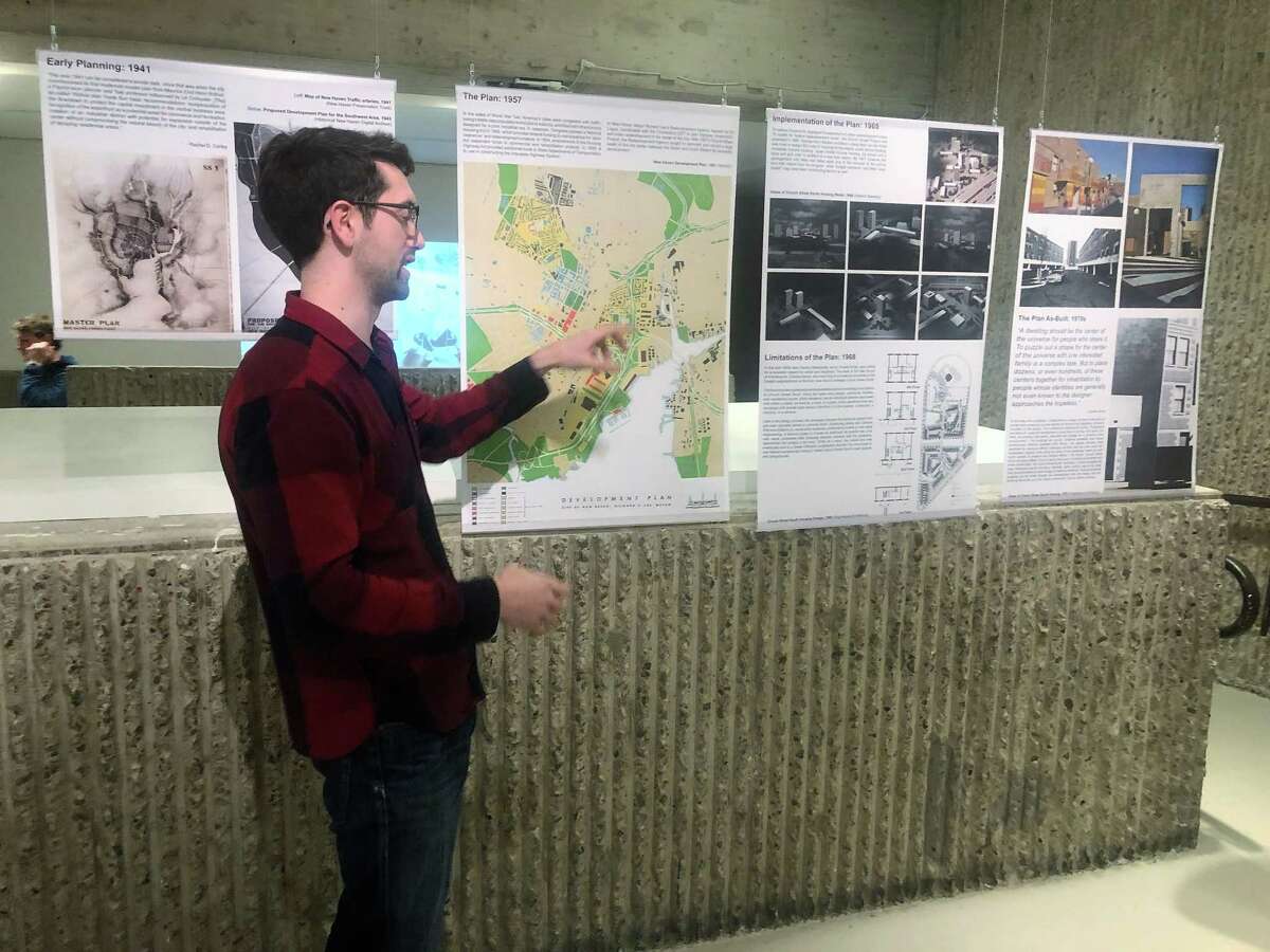Jonathan Hopkins describes his exhibit for members of The New Haven Preservation Trust. The exhibit ”Redevelopment: The Story of Church Street South,” at YalesSchool of Architecture, will be open weekdays from 9-5 until Jan 3.