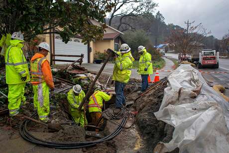 PG&E subcontractors with Alvah Contractors dig out trenches to replace underground power lines that were damaged in the Tubbs Fire, Friday Dec. 13, 2018, in Santa Rosa, Ca.