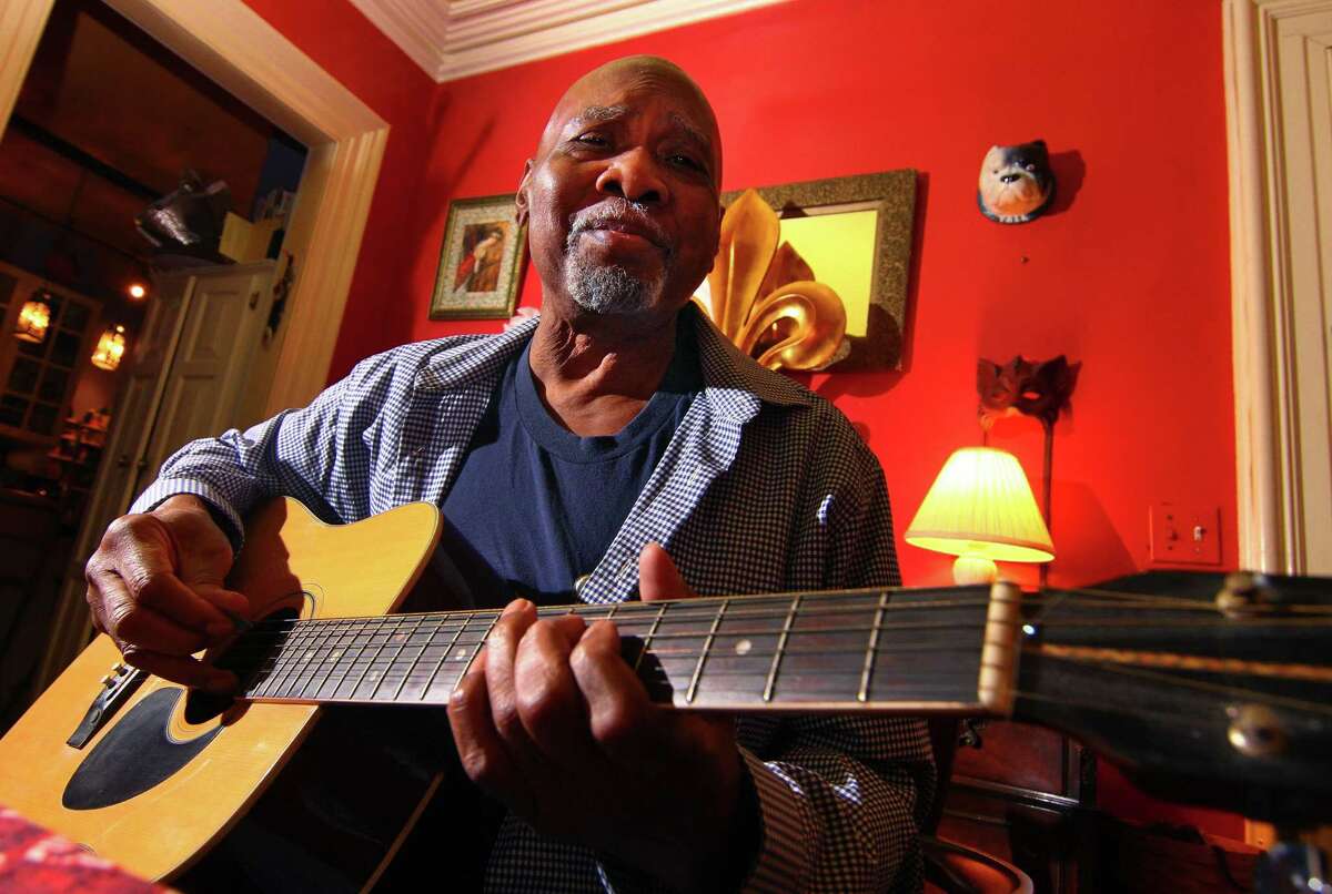 Musician George Baker poses at his friend’s home in New Haven Friday.