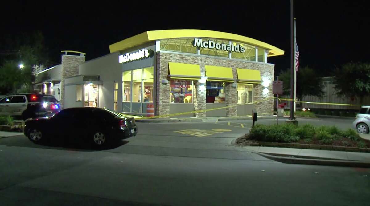 A man trying to rob a McDonald's on the Northwest Freeway was hospitalized after being shot by a customer Friday night.