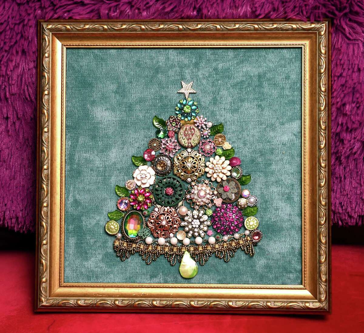 A Christmas tree made by Kristin Abalan of Branford from found brooches, buttons and other items.