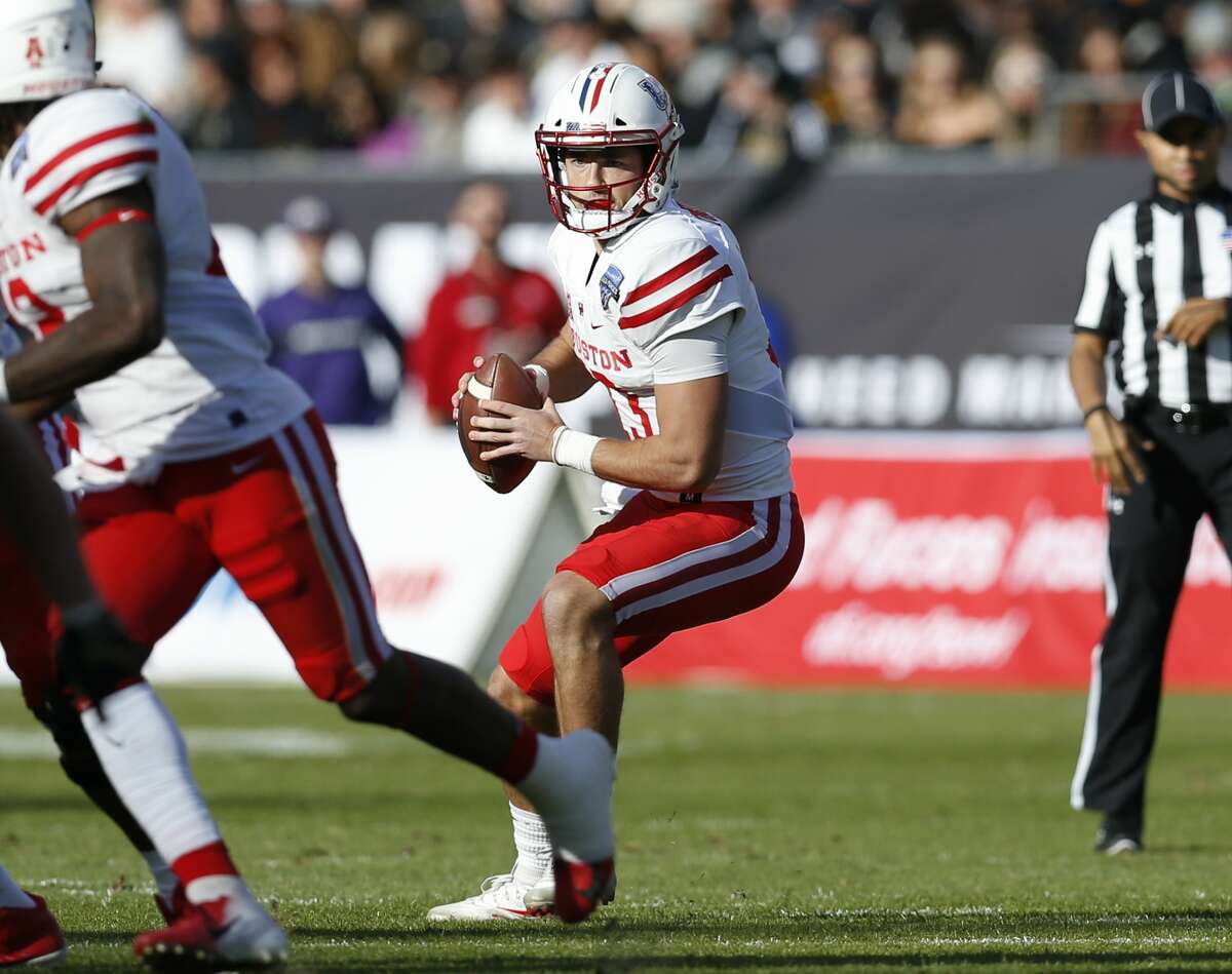 Houston quarterback Clayton Tune (13) looks to pass against Army during the first half of Armed Forces Bowl NCAA college football game Saturday, Dec. 22, 2018, in Fort Worth, Texas. (AP Photo/Jim Cowsert)