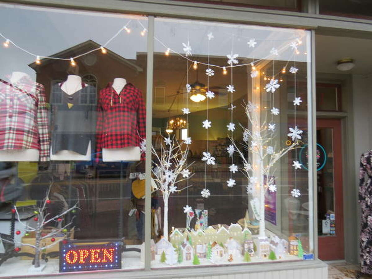 Revival Boutique & Gifts created a small village in the window, with snowflakes falling down.