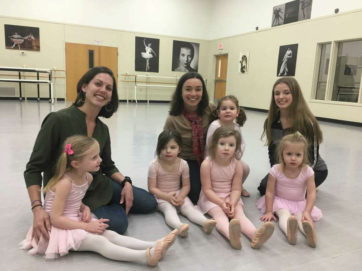 School of the Arts Co-directors Joan Anderson and Cristiane Santos sit with students from the National Museum of Dance School of the Arts students, from left, Ella Dobies, Olivia Conklin, Eve Cornish, Stella Zuppa (on Santos lap), Alexandra Nicolaus and Reese Dobies in one of the school's studios on Dec. 21, 2018. (Wendy Liberatore/times Union)