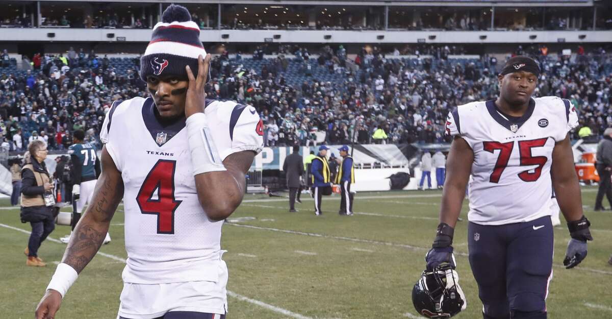 Houston Texans quarterback Deshaun Watson (4) and offensive tackle Martinas Rankin (75) walk off the field after the Texans lost 32-30 to the Philadelphia Eagles in an NFL football game at Lincoln Financial Field on Sunday, Dec. 23, 2018, in Philadelphia.