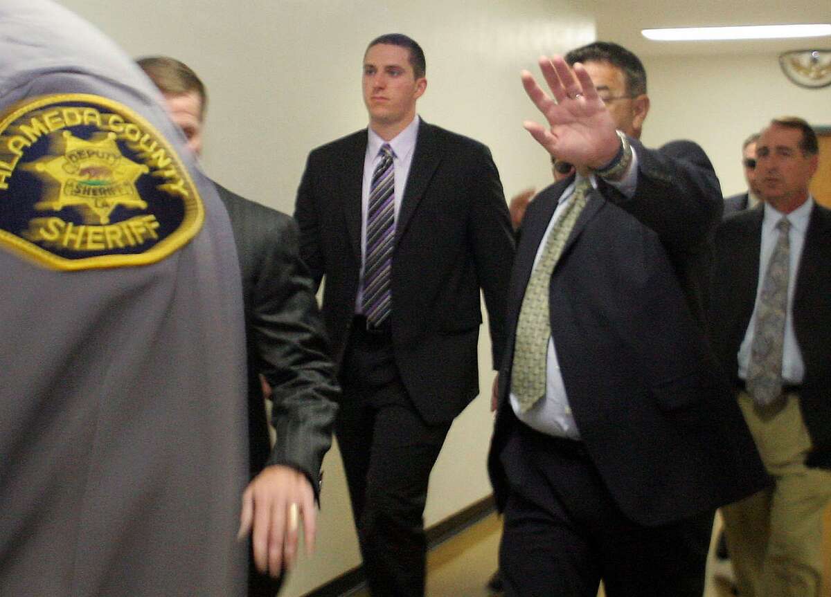 Former BART police officer Johannes Mehserle, center, arrives at Renee C. Davidson Courthouse in Oakland, Calif., on Monday, May 18, 2009. Two women at a train station recording a young man being shot by Mehserle said that police were unnecessarily aggressive during the deadly confrontation. Their videos of the chaotic scene and separate testimony were among the opening highlights of a preliminary hearing in Alameda County Superior Court against Mehserle, who is charged with murdering Oscar Grant on New Year's Day. (AP Photo/Oakland Tribune, Laura A. Oda) ** NO SALES, MAGS OUT, MANDATORY CREDIT **