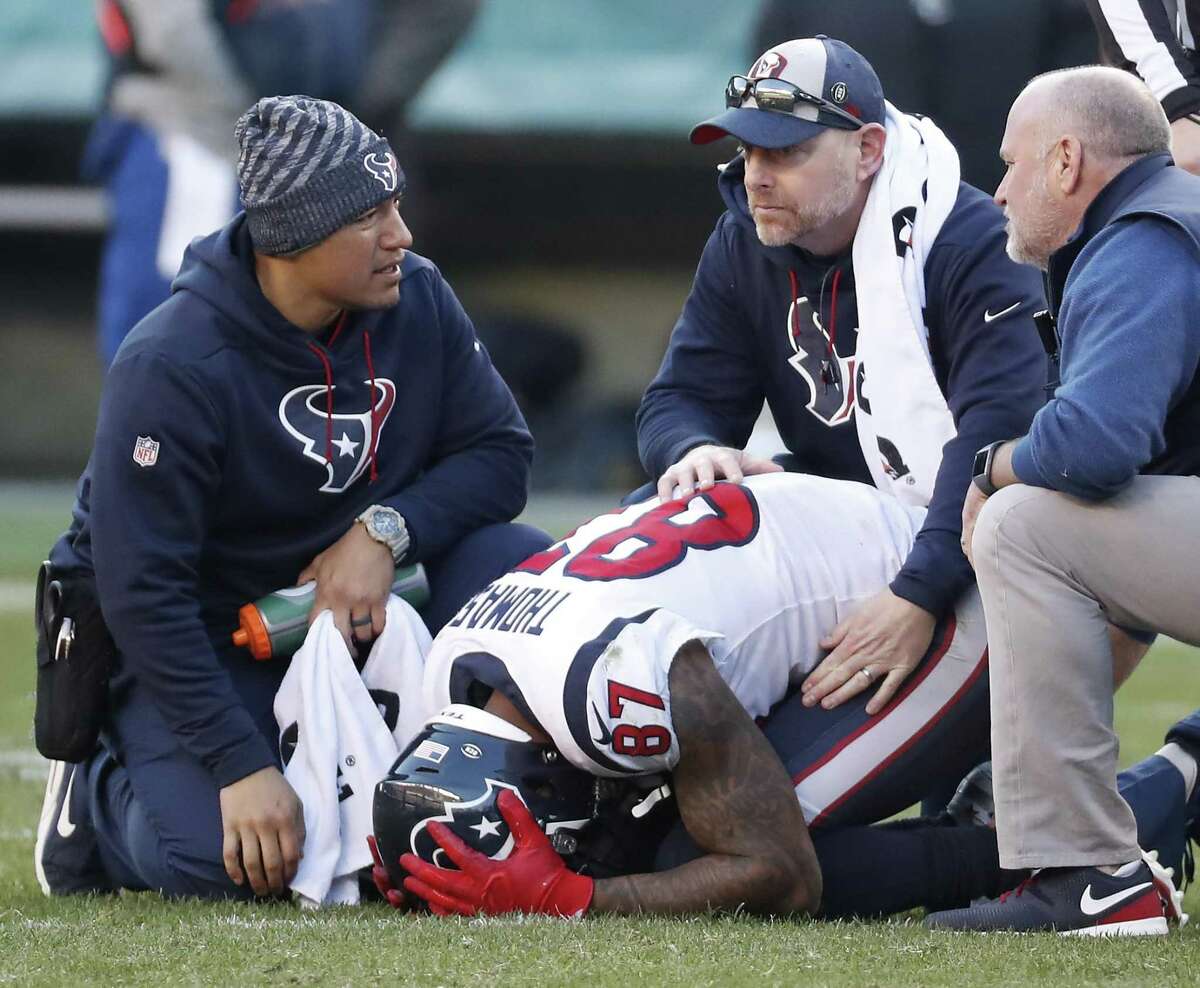 Houston Texans wide receiver Demaryius Thomas (87) is tended to by the training staff after suffering an inury against the Philadelphia Eagles during the fourth quarter of an NFL football game at Lincoln Financial Field on Sunday, Dec. 23, 2018, in Philadelphia.