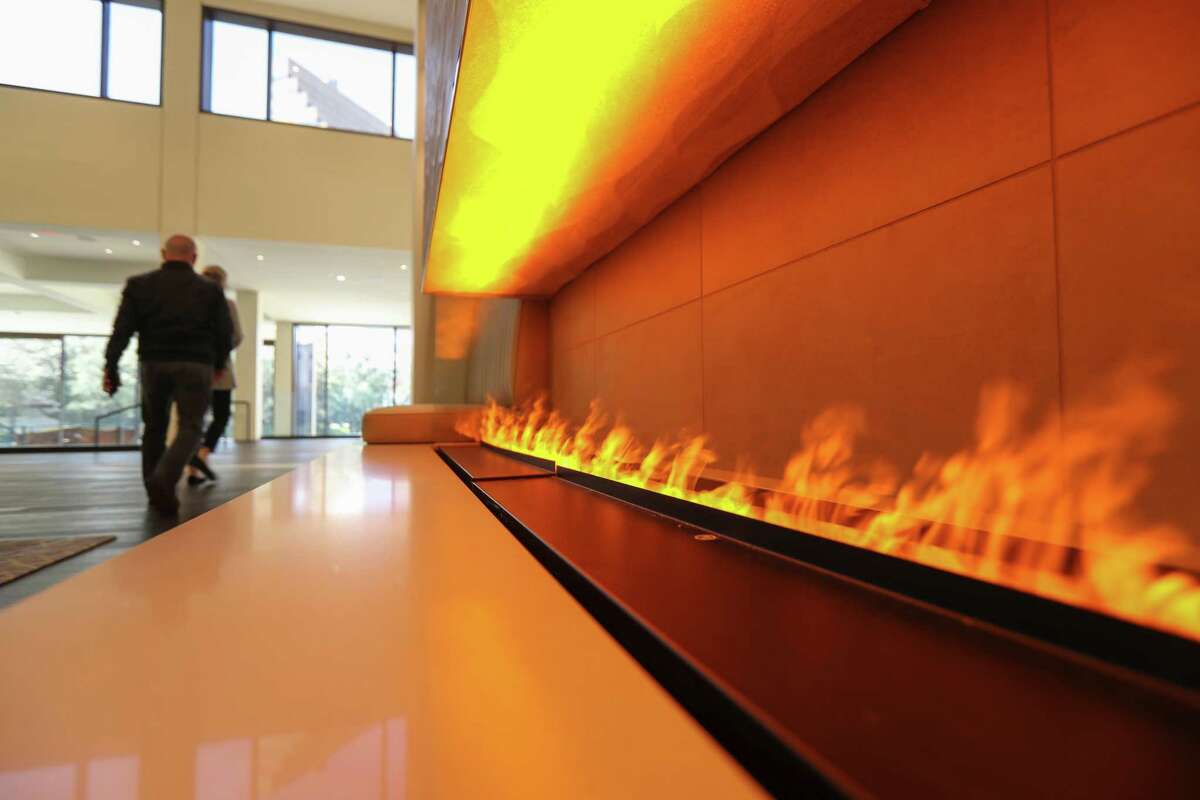 A long fireplace adds a warm glow to the lobby.