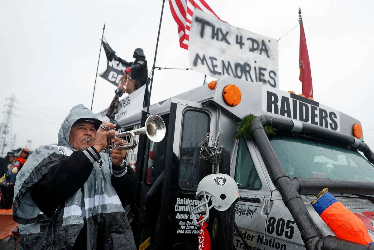 Oakland Raiders fans tailgate in rain at their team's likely last Coliseum  game