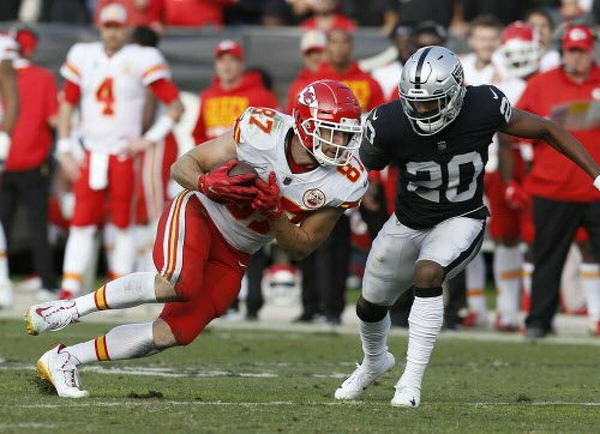 Kansas City Chiefs tight end Travis Kelce (87) runs against Oakland Raiders cornerback Daryl Worley (20) during an NFL football game in Oakland, Calif., Sunday, Dec. 2, 2018. (AP Photo/D. Ross Cameron)