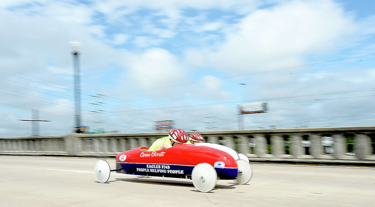 Competitors race down the Maury Meyer Bridge as they vie for the win at the finish in the annual Southeast Texas All-American Soap Box Derby races. The finals will be held Sunday, with winners earning a spot for the national competition in Akron, OH. Photo taken Saturday, May 5, 2018 Kim Brent/The Enterprise