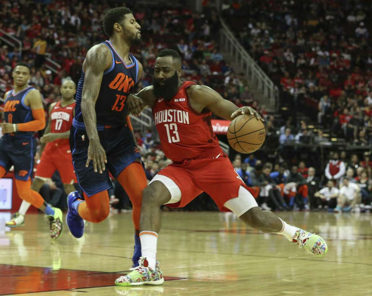 Despite Thunder forward Paul George’s best defensive efforts, James Harden, right, created enough room to produce a 41-point performance Tuesday at Toyota Center. It was the Rockets star’s fifth consecutive game with at least 35 points.