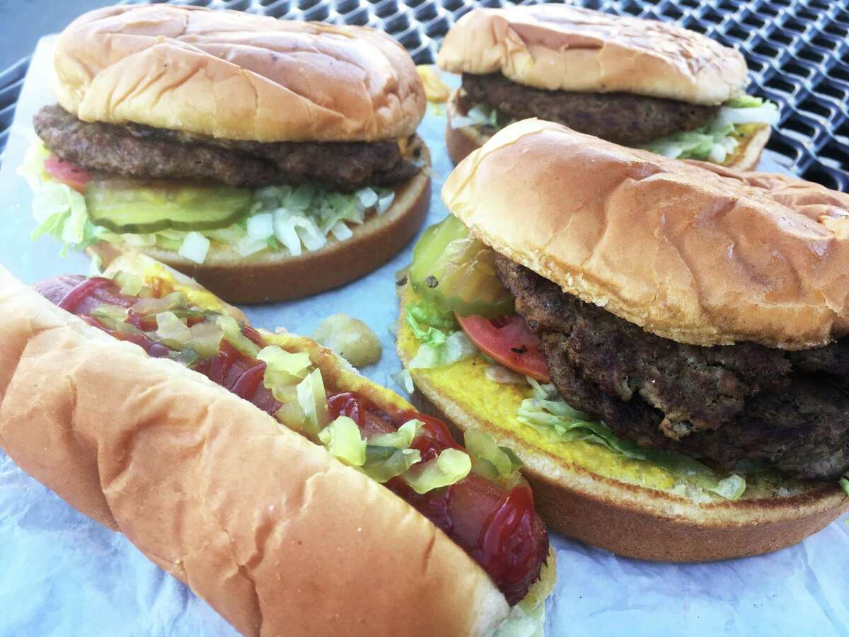 A trio of Burger Boy burgers with the dressed hot dog.