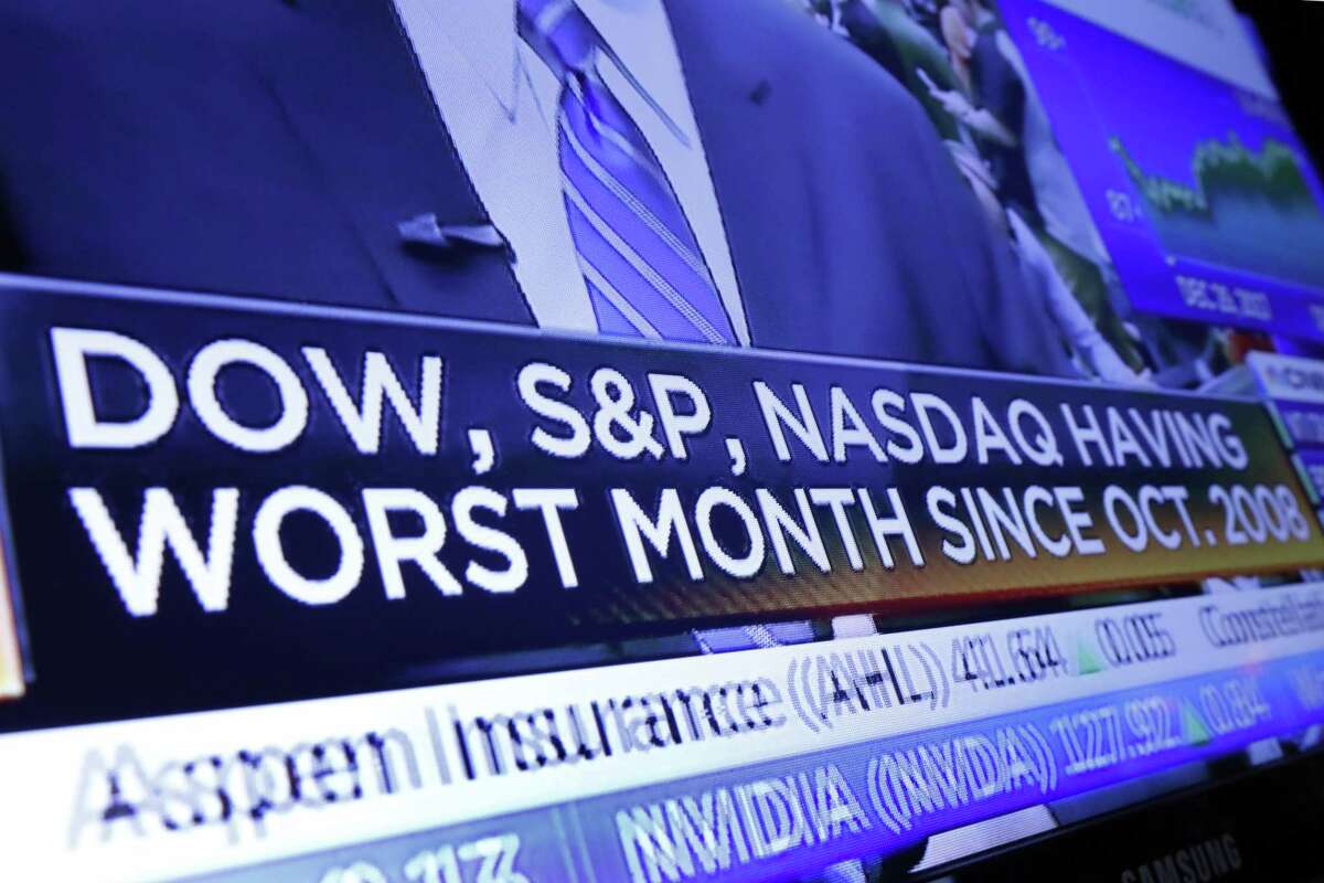 A headline appears on a television screen on the floor of the New York Stock Exchange, Wednesday, Dec. 26, 2018. Stocks opened strongly higher on Wall Street Wednesday, with real estate, raw materials and energy stocks leading a broad rebound from Monday's steep losses. (AP Photo/Richard Drew)