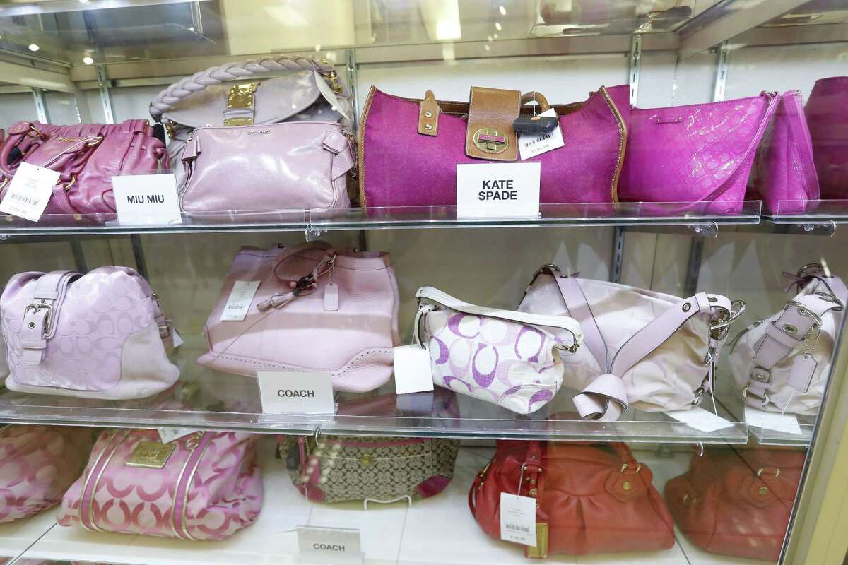 LXR and Co. purses on display that include Kate Spade, Coach, Ferragamo, and Balenciaga at the ThredUp pop-up shop inside of the Palais Royal store in Meyerland, Wednesday, Nov. 21, 2018, in Houston. The store-within-the-store offers second-hand clothing that appeals to shoppers who like to thrift shop.