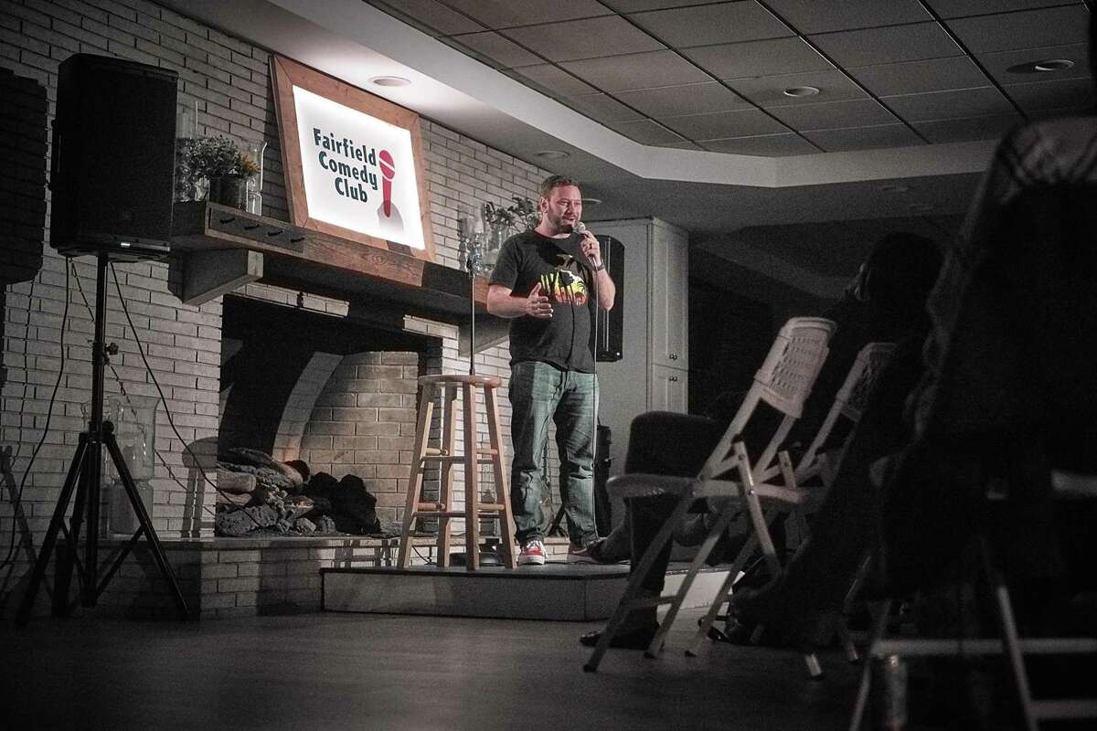 Joe Gerics, host of the Fairfield Comedy Club warms up the crowd in the Circle Inn's lobby.