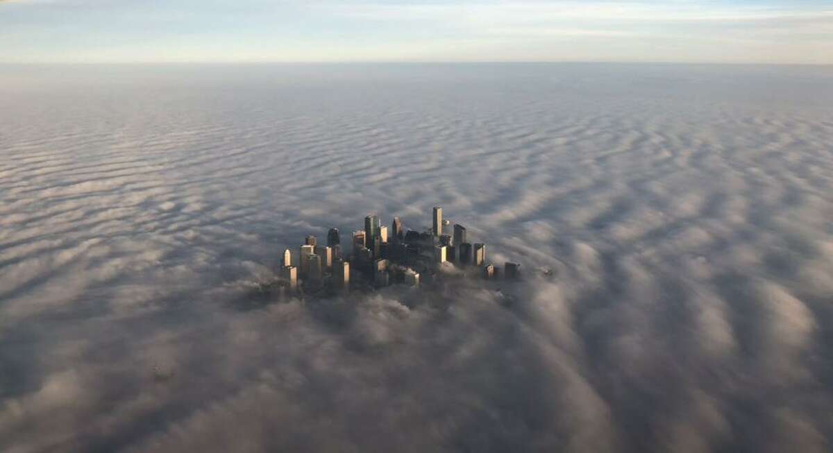 A passenger on a Southwest flight from Houston to Seattle took this photograph of downtown as fog blanketed the region Tuesday, Dec. 18, 2018.