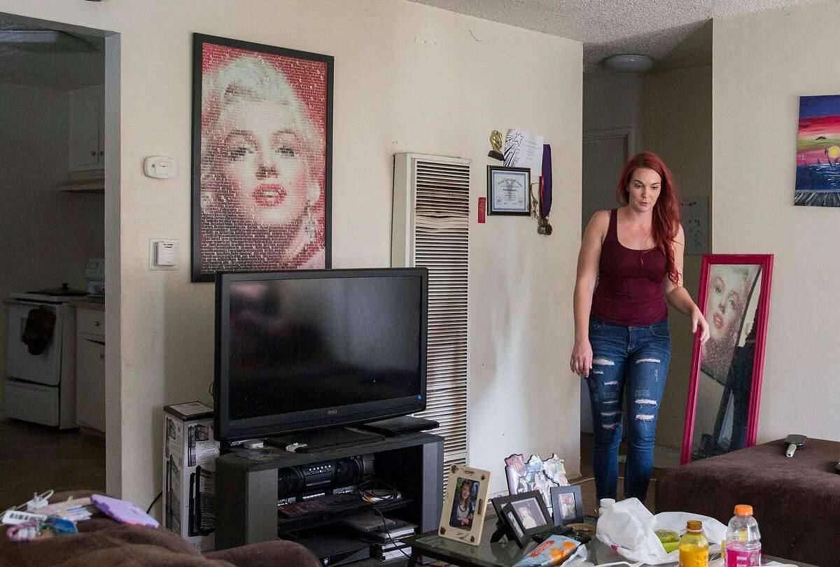 Crystal Chandler walks through her apartment in Concord, Calif. Saturday, Sept. 29, 2018.