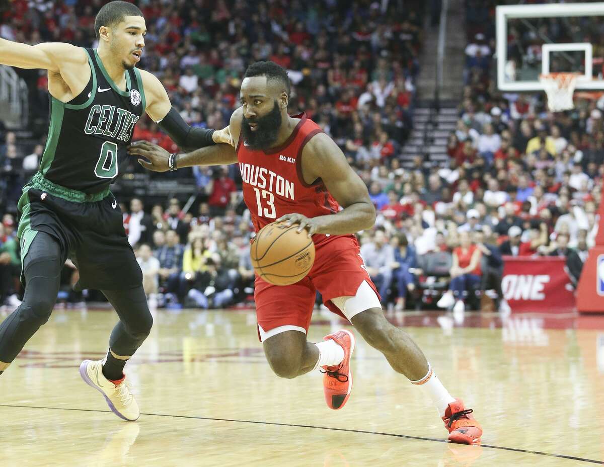 Houston Rockets guard James Harden (13) drives to the hoop past Boston Celtics forward Jayson Tatum (0) at the Toyota Center on Thursday, Dec. 27, 2018 in Houston. Rockets won the game 127-113.