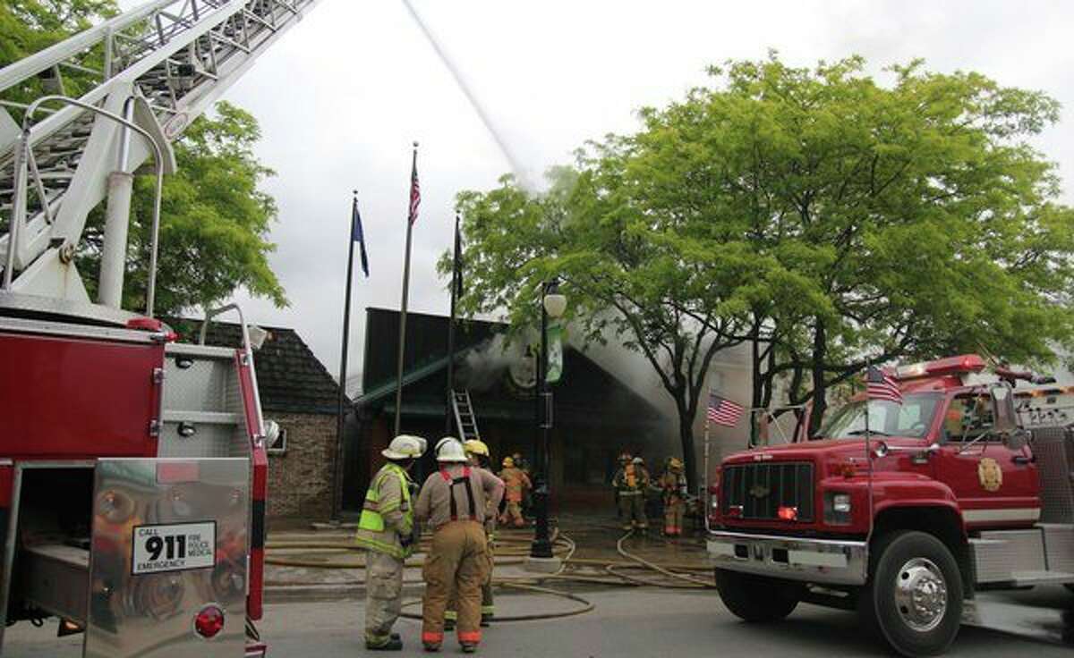 Numerous fire departments were on scene June 19 in downtown Port Austin, where The Stock Pot restaurant had caught fire. The fire caused irreparable damage to The Stock Pot, and it also damaged two surrounding restaurants, The Sportsman's Inn and The Landing Tavern. (Tribune File Photo)