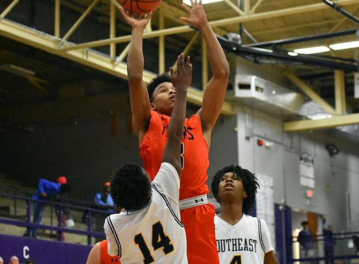 Edwardsville guard Malik Robinson goes up for a shot in traffic in the third quarter against Springfield Southeast.