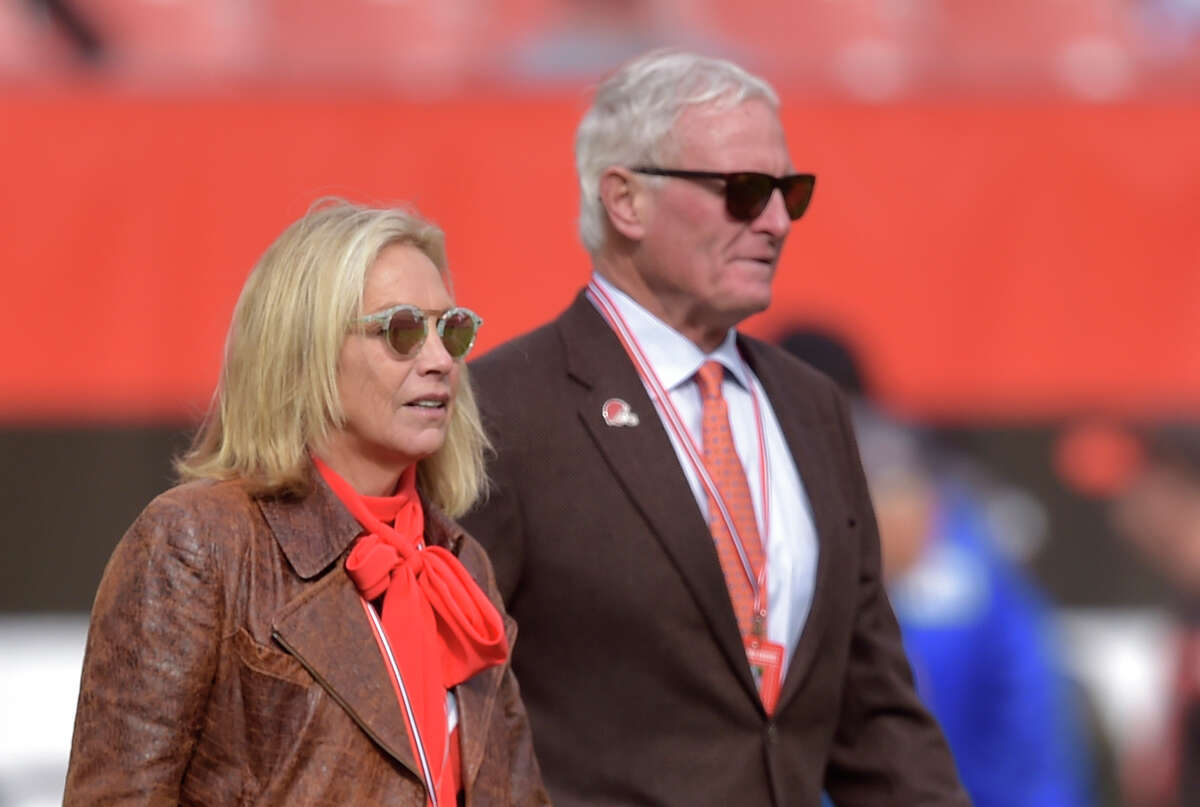 File-This Nov. 4, 2018, file photo shows, Cleveland Browns owners Dee and Jimmy Haslam walk on the field prior to an NFL football game against the Kansas City Chiefs, in Cleveland. The Browns owners have bought the Columbus Crew, guaranteeing the team will not relocate. The Haslams have been working for months with the a group to keep the Major League Soccer franchise in Ohio. (AP Photo/David Richard, File)
