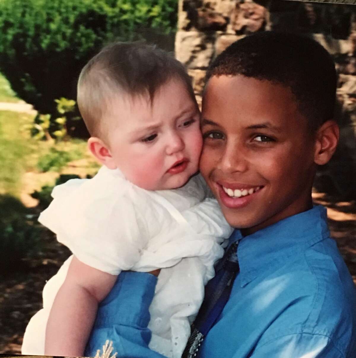 Stephen Curry poses with Cameron Brink at Brink's baptism in Lake George, NY.