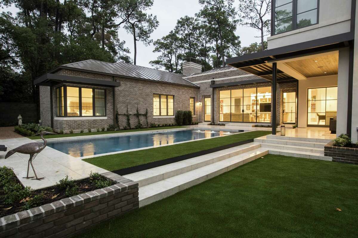 The lines and elevations in the backyard mimic the home's architecture and interiors, says the Keiths' landscape architect, Richard Dawson of Dawson Estes, Inc.
