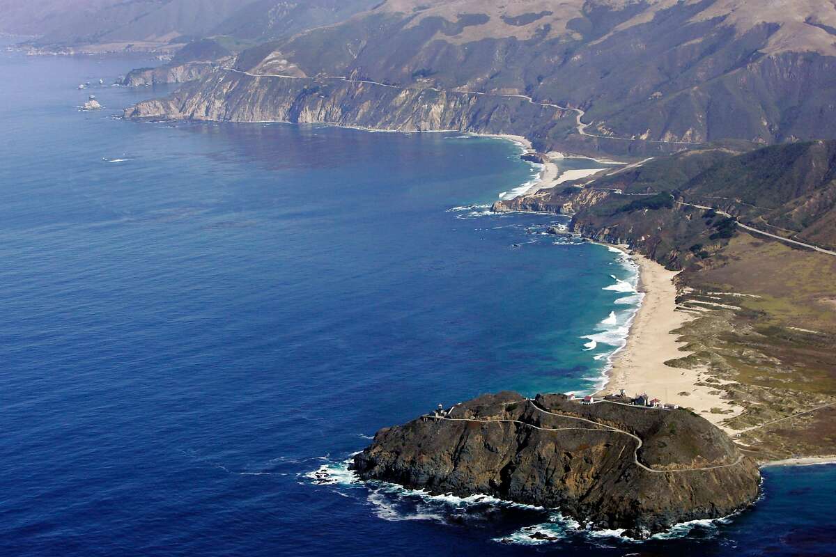 FILE- This Sept. 24, 2006 file photo shows the Point Sur State Marine Reserve in an aerial view in Big Sur, Calif. The road to Big Sur is a narrow, winding one, with the Pacific Ocean on one side, spread out like blue glass, and a mountainside of redwoods on the other. (AP Photo/Marcio Jose Sanchez)