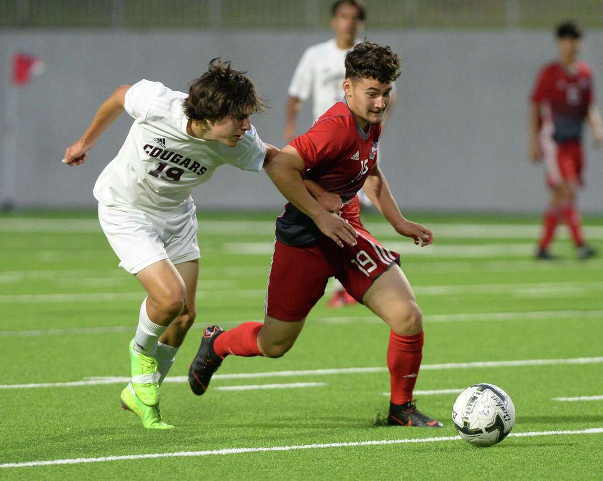 Cy Lakes is among the 26 teams competing in the CFISD Men’s Varsity Soccer Showcase on Jan. 3-5. Midfielder Selvin Zamora (19) of Cy Lakes competes for a ball during the first half of a 6A-III area round soccer playoff between the Cinco Ranch Cougars and the Cy Lakes Spartans on Tuesday, April 3, 2018 at Legacy Stadium, Katy, TX.
