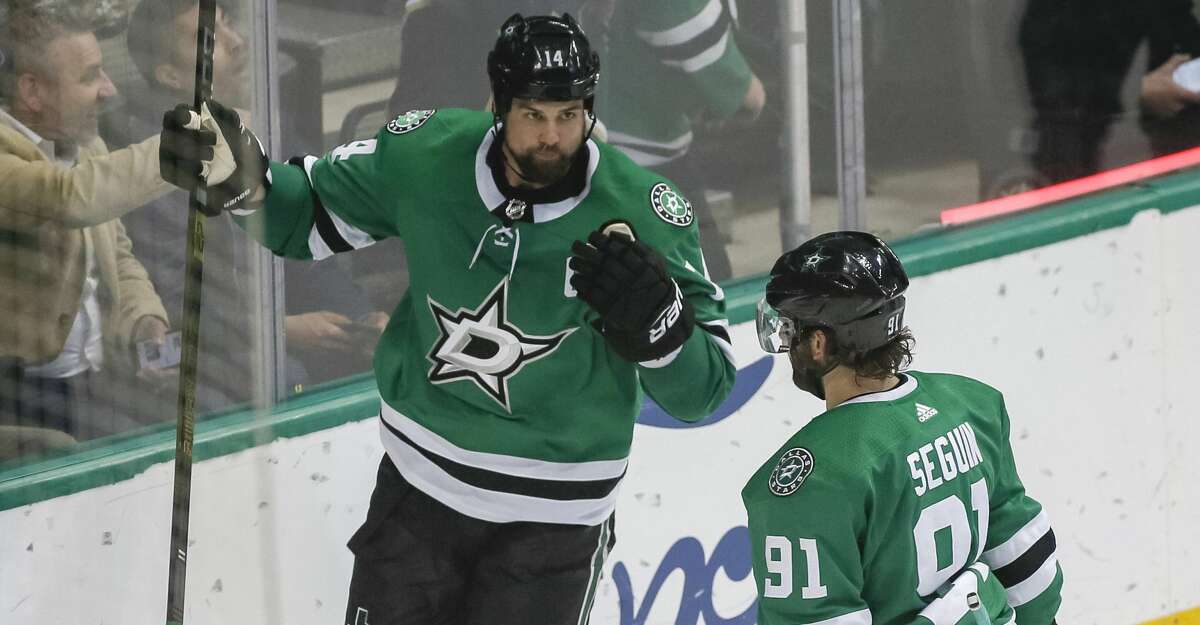 Dallas Stars left wing Jamie Benn, left, celebrates his goal with Dallas Stars center Tyler Seguin, right, against the Edmonton Oilers during the third period of an NHL hockey game Monday, Dec. 3, 2018, in Dallas. (AP Photo/Ray Carlin)