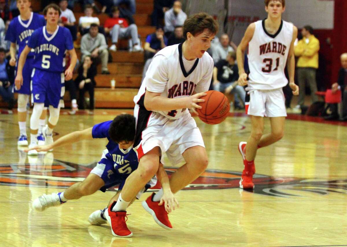 Fairfield Warde's Jack McKenna (44) steals the ball away from Fairfield Ludlowe's Chris Carlucci (15) during Fairfield Prep Holiday Classic basketball tournament action in Fairfield, Conn., on Friday Dec. 28, 2018. Warde beat Ludlowe 38-37.