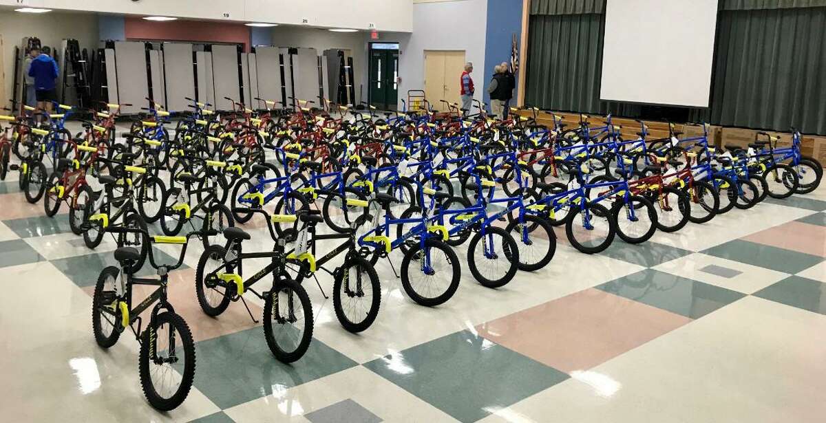 CYCLE volunteers delivered bicycles for second-graders at Goodman Elementary School in Fort Bend Independent School District. It is one of 10 elementary schools in Fort Bend ISD that participated this year in the program. CYCLE — Changing Young Children's Lives Through Education — offers bicycles as an incentive to encourage youngsters to improve their reading skills.