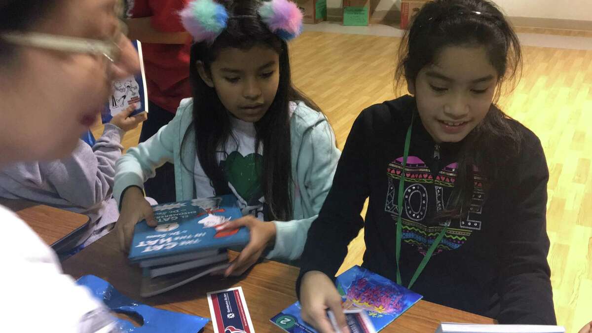 Students at Bear Creek Elementary School each received six books as part of an initiative by the Barbara Bush Houston Literacy Foundation.