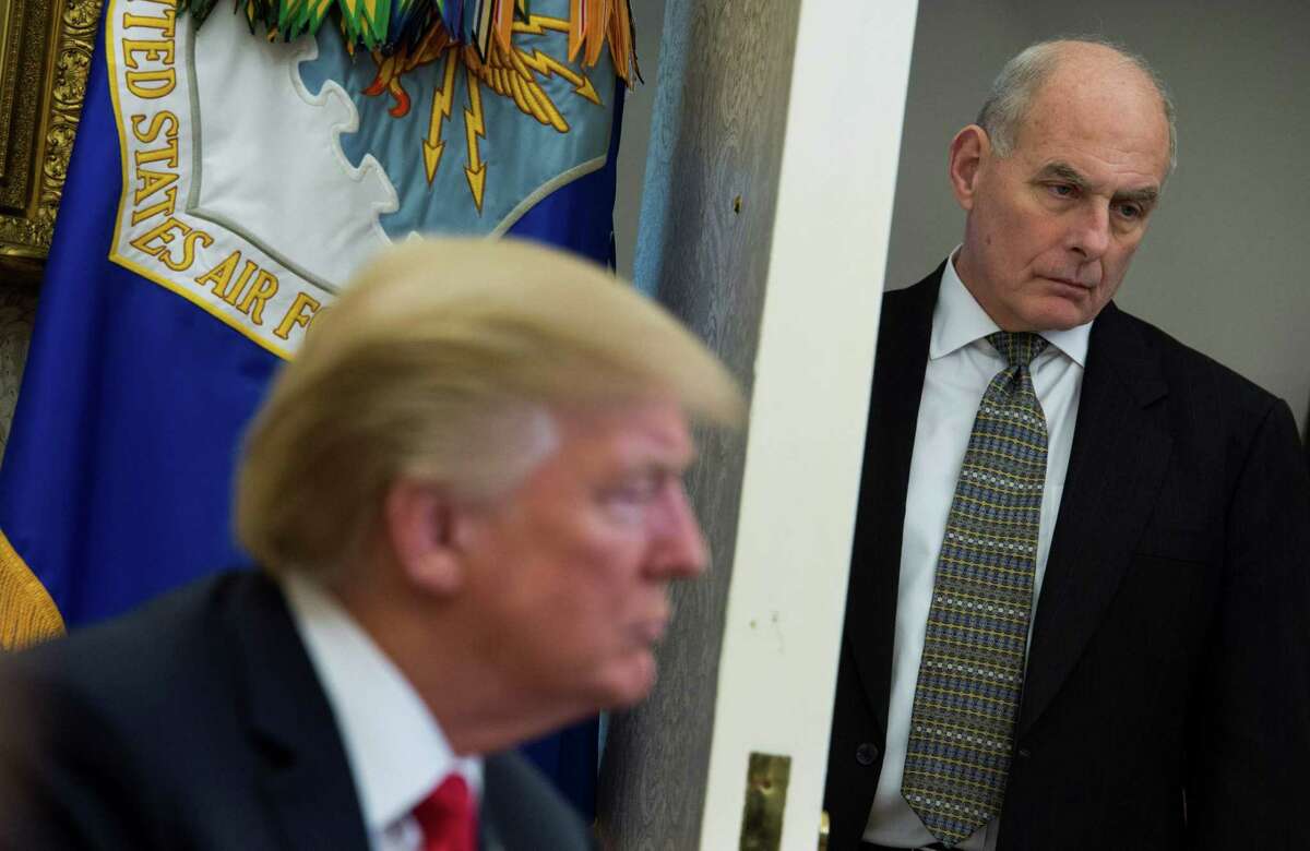 White House Chief of Staff John Kelly looks on as President Donald Trump meets with North Korean defectors in the Oval Office at the White House on Feb. 2. Kelly, in an interview Sunday that jarred with President Donald Trump's tough rhetoric on immigration, said he had “nothing but compassion” for undocumented migrants crossing into the US and undercut the idea of a border wall.