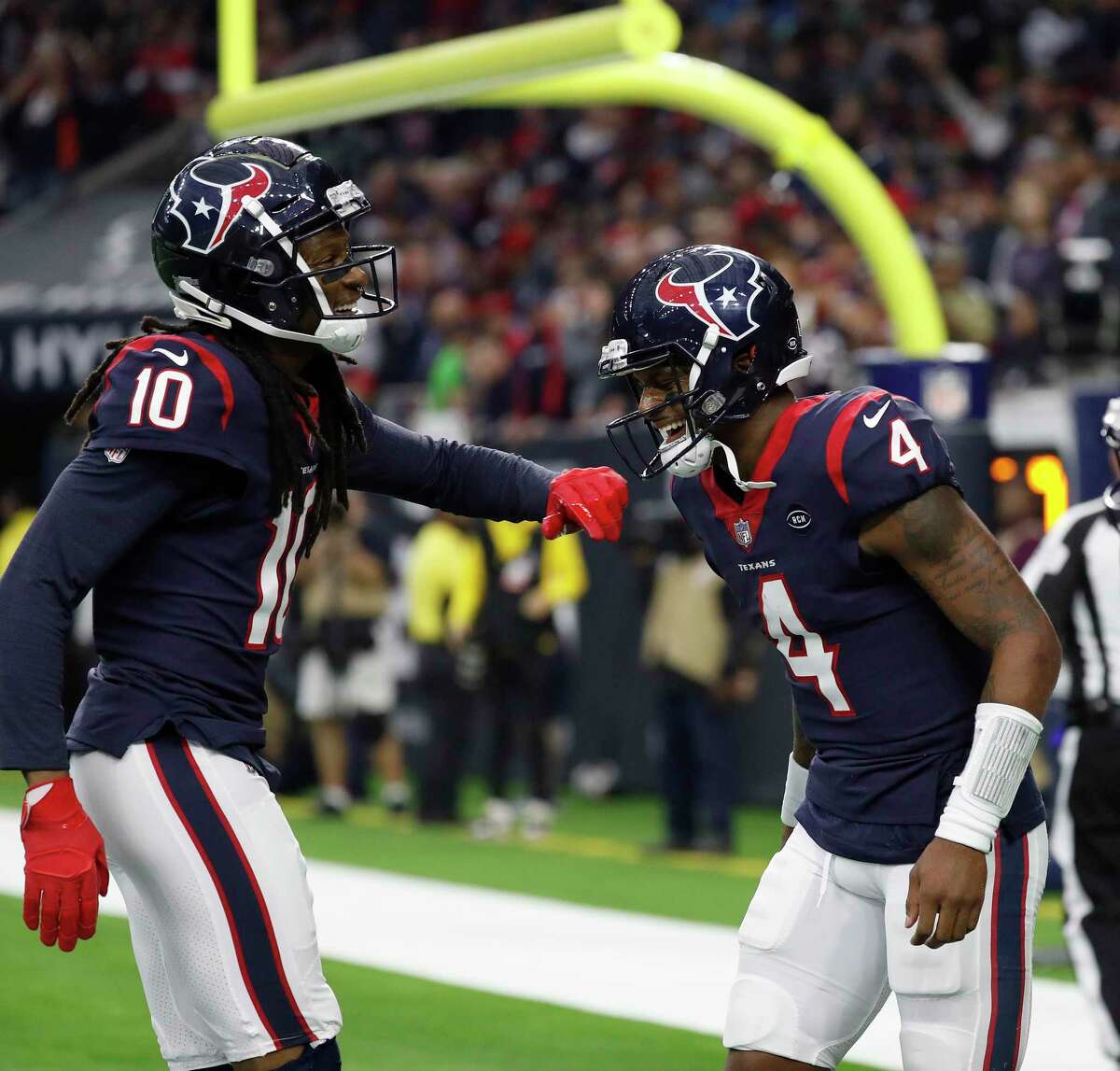 Houston Texans quarterback Deshaun Watson (4) celebrates with wide receiver DeAndre Hopkins (10) after Watson's touchdown during the second quarter of an NFL football game at NRG Stadium, Sunday, Dec. 30, 2018, in Houston.